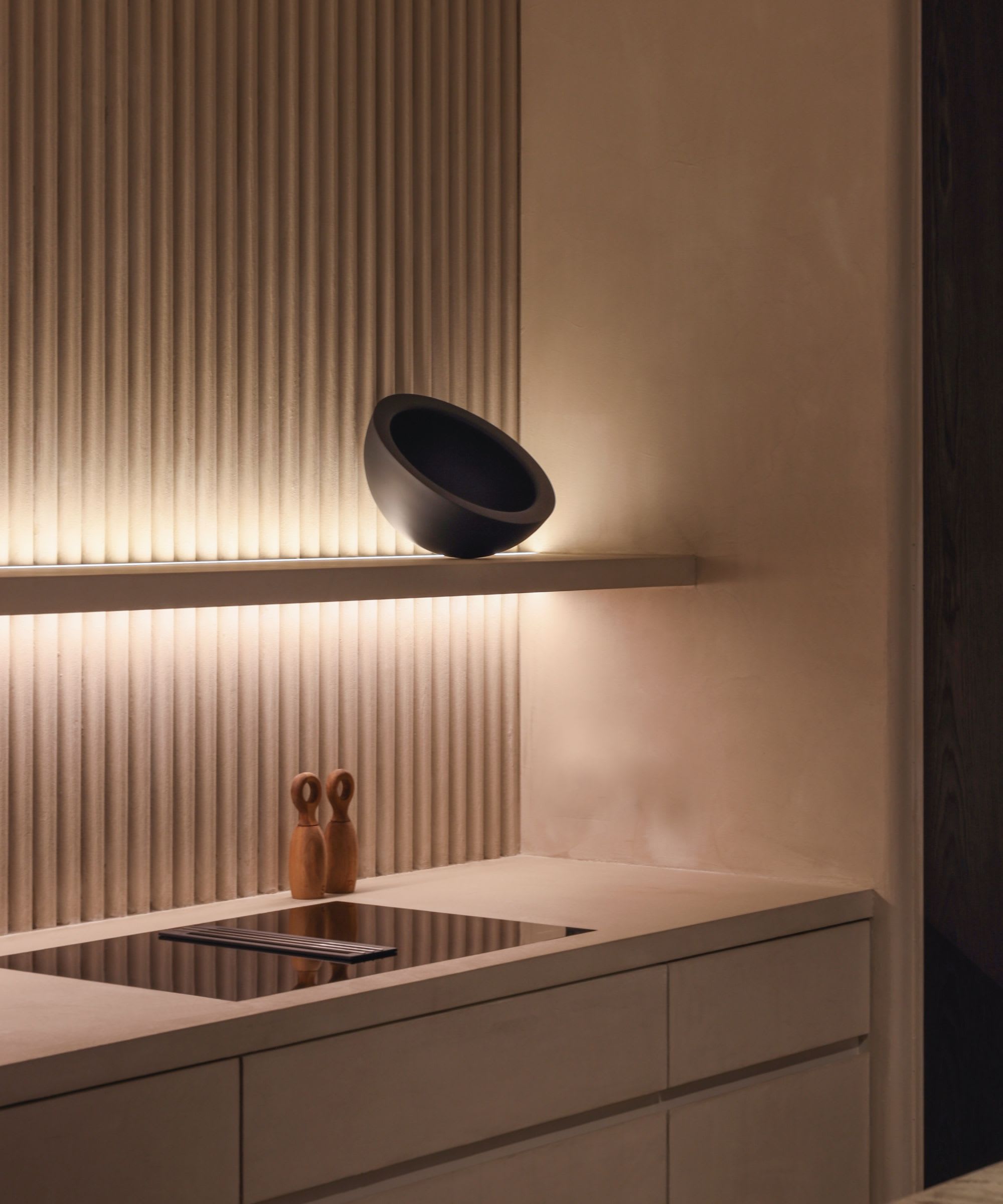 Minimalist designer kitchen detail in a film rental listing